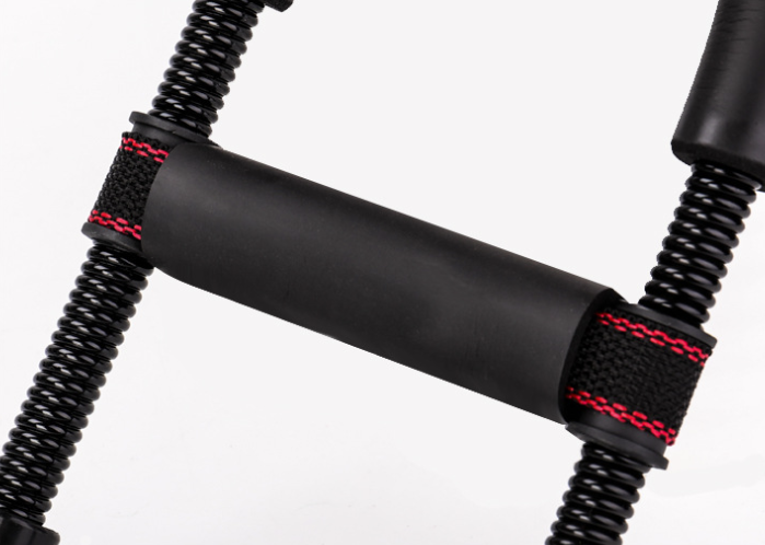 Spring wrist trainer with foam grip