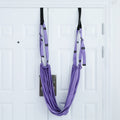 Woman stretching with a door yoga strap